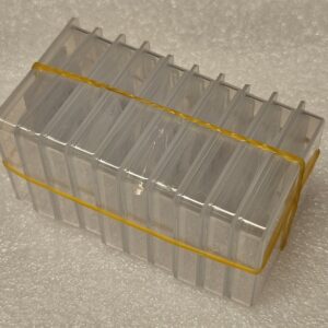 Pack of ten protective laser welder lenses held together with rubber bands